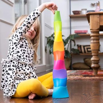 Child using dimpl stacking cups